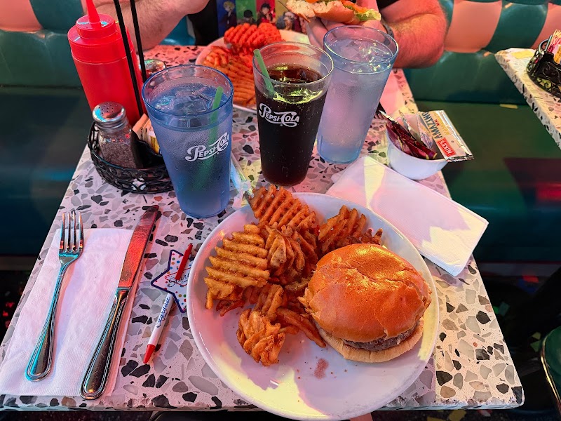 Food and interior photo 3 at Ellen's Stardust Diner in New York