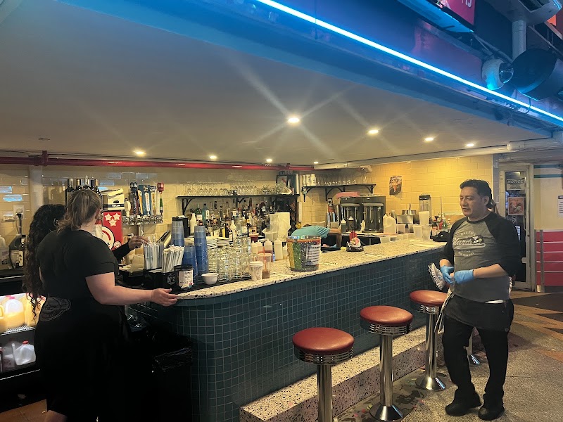 Food and interior photo 1 at Ellen's Stardust Diner in New York